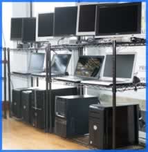 computers on a shelving unit